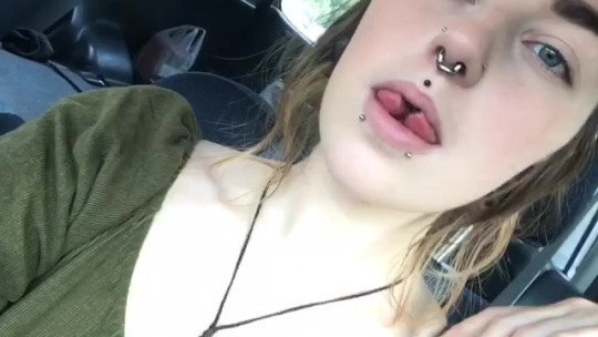 Beautiful girl showing split tongue gotta