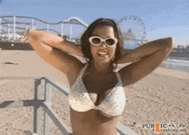 Tanned beautiful girl goes topless beach