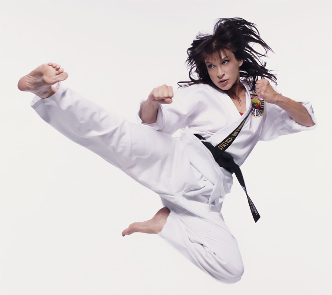 Martial artist woman double kicks